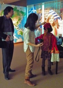 Participants can try on clothing used by the the Greek immigrants