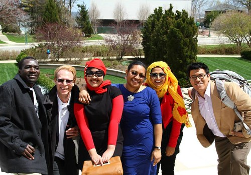 President Ron Harvey with Fulbright students who have completed their programs 