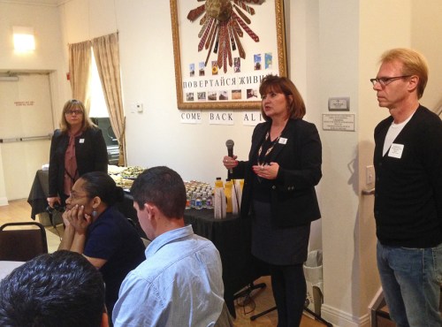 Anna kkkkkk from the Ukrainian National Museum welcomes the participants. Next to her, Ron Harvey, Chicago chapter president and Maria kkk, who also guided the museum's tour