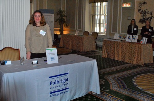 Chicago Chapter Board Member Meredith Mc Neil at the Fulbright table during the fair prior to the luncheon