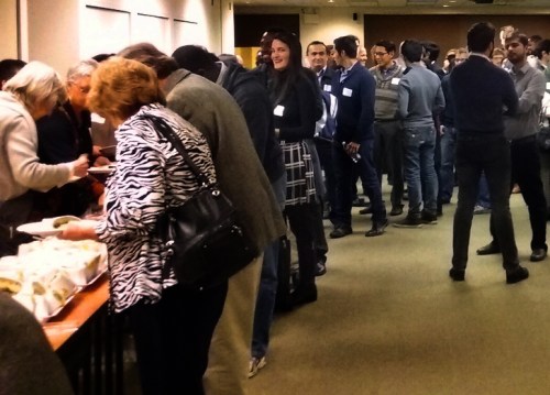 Atendees exchange ideas over a catered meal.