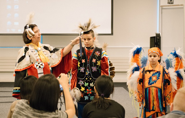 Dr. Wiese describing the American Indian garments.